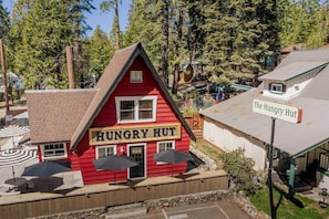 Situated in a serene forest setting, The Hungry Hut offers a charming atmosphere.