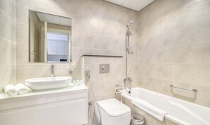 Bathtub, hair dryer, towels, soap