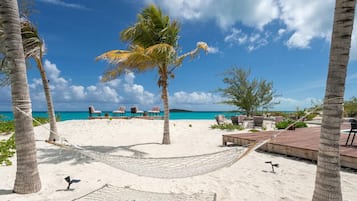 On the beach, sun loungers, beach towels