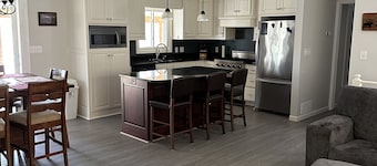 Mission Lake home with dock and sandy bottom