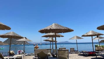 Beach nearby, white sand, beach cabanas, beach bar
