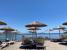 Beach nearby, white sand, beach cabanas, beach bar