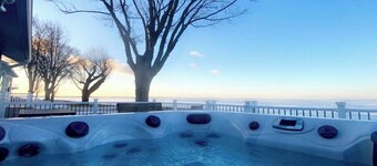 Enjoy Beautiful Sunsets at this Lake House w a HOT TUB, Boat Garage and Game Rm 