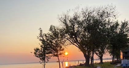 Enjoy Beautiful Sunsets at this Lake House w a HOT TUB, Boat Garage and Game Rm