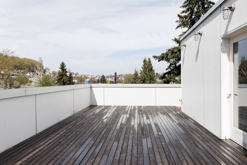 Urban Architectural Retreat with Rooftop Deck & Fireplace