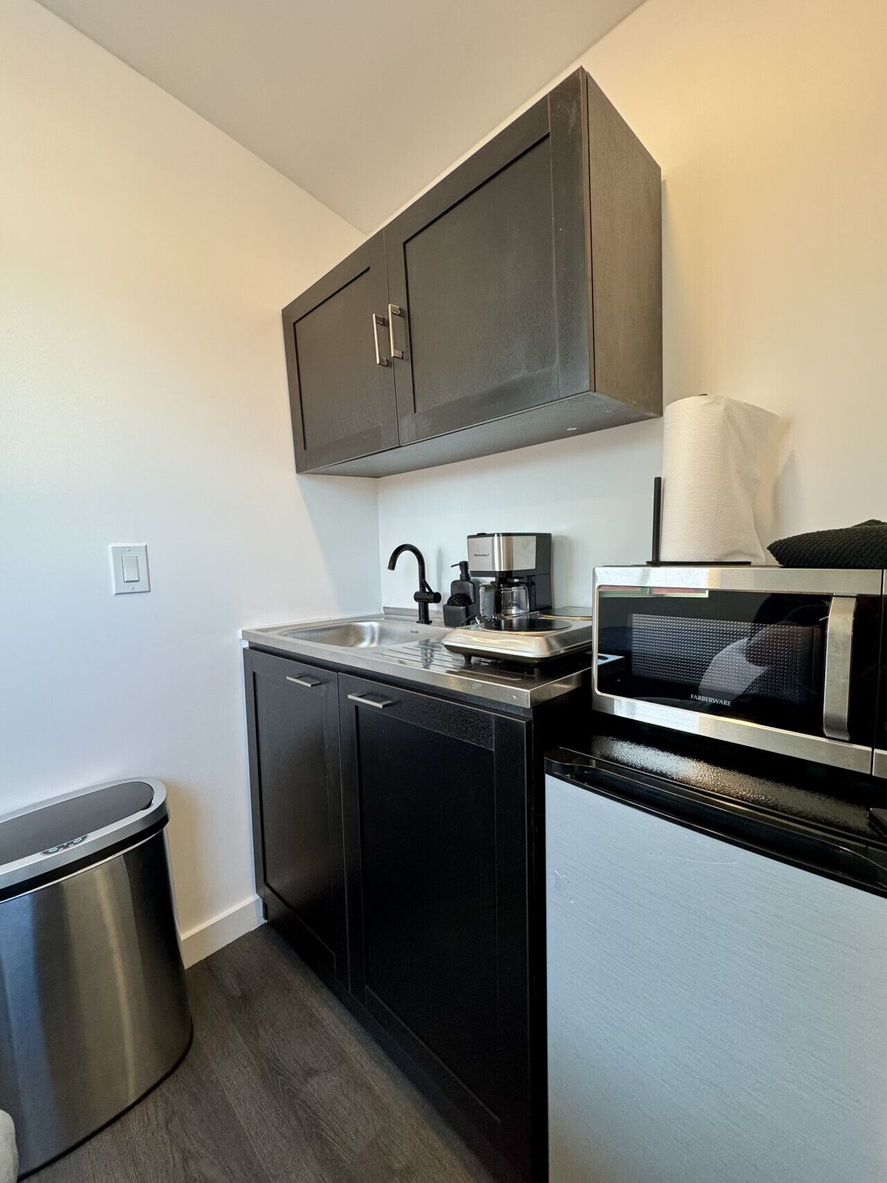 Fridge, microwave, coffee/tea maker, cookware/dishes/utensils