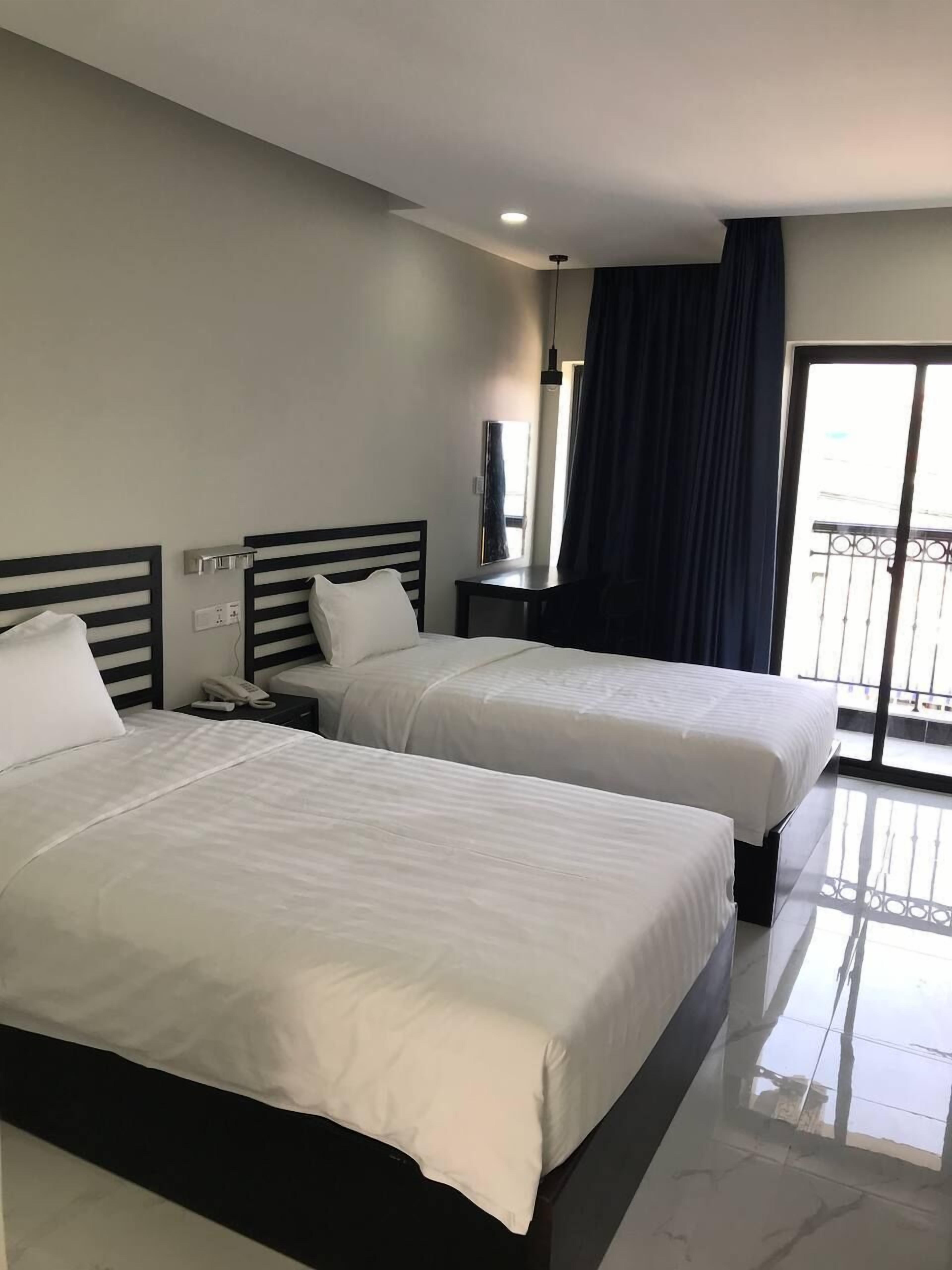 deluxe twin room | in-room safe, desk, iron/ironing board, free wifi