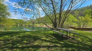 Outdoor dining - Peaceful A-Frame Home in Kentucky • Hot Tub, Sauna & Private Fishing Pond (Irvine)