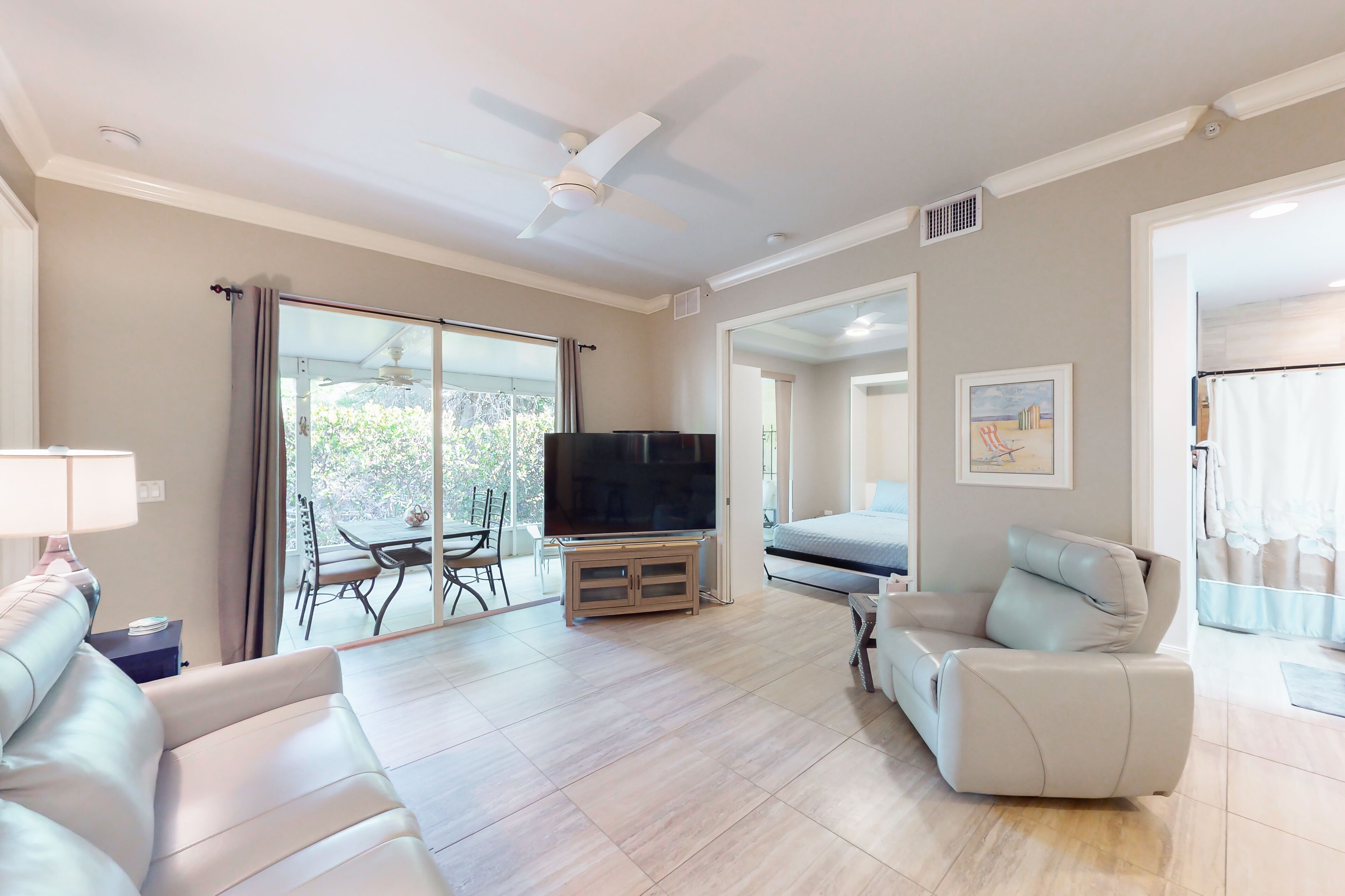 Updated condo with pool, screened porch, outdoor kitchen, W/D, & AC