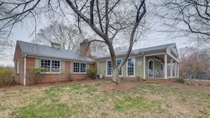 A two-story house with a front porch and a garage. - Nature Getaway w/ On-Site Trails, 17 Mi to DC! (Brookeville)