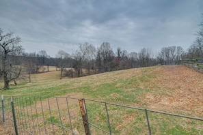 Surrounded by rolling hills and lush greenery, this serene landscape offers a peaceful escape.