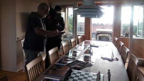 A dining area with a long table, chairs, and a chandelier. - v. Limfjord, 3 km to Thisted, views, bikes, self-check-in possible  (Thisted)