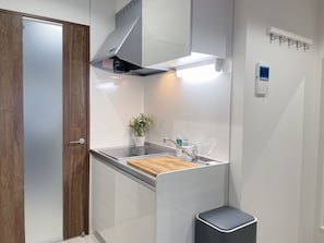 Premium Apartment | Private kitchen | Full-size fridge, microwave, stovetop, electric kettle - Dotonbori Royal (Osaka)