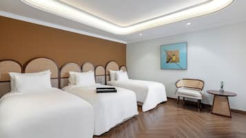 Deluxe Triple Room | Hypo-allergenic bedding, down comforters, minibar, in-room safe