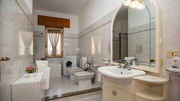 Bathtub, hair dryer, towels