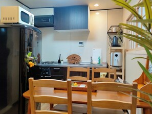 Fridge, microwave, cookware/dishes/utensils