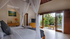 A bedroom with a bed, a desk, a television, and a balcony with a view of the outdoors. - Kelusa Hill (Payangan)