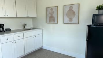 Microwave, toaster, dining tables