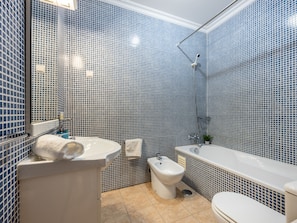 Bathtub, hair dryer, towels