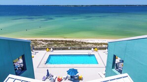 A pool with a view of the beach and ocean. - Escape to paradise at Palm Beach Club #217/Sound Front Condo! (Pensacola Beach)