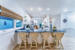 Toaster, ice maker, dining tables