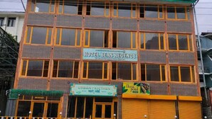 A multi-story building with a sign for "Hotel Beas Recency." - Hotel Beas regency (Manali)