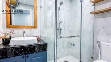 Comfort Room | Bathroom | Shower, designer toiletries, hair dryer, slippers