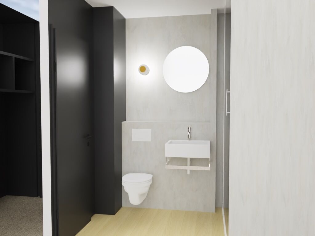 A modern bathroom with a toilet, sink, and a round mirror on the wall.