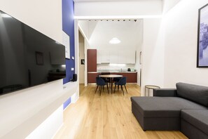 Comfort Apartment | Living area | 40-inch flat-screen TV with digital channels, TV