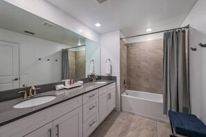 Bathtub, hair dryer, towels