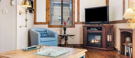 Cabin, 1 King Bed with Sofa bed, Balcony (Skipjack Cottage Branson) | Living area | 41-inch flat-screen TV with digital channels, fireplace