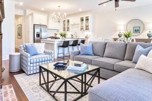 A modern living room with a sofa, armchairs, and a coffee table. - The Sadie, Walk to Campus, by Velvet Ditch Villas (Oxford)