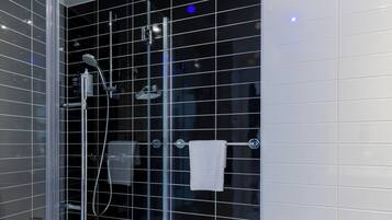 Shower, hydromassage showerhead, eco-friendly toiletries, hair dryer