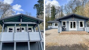 A two-story building with a covered porch and a small deck. - Valley Lodge (Tiverton)