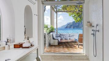 Eco-friendly toiletries, hair dryer, bathrobes, slippers