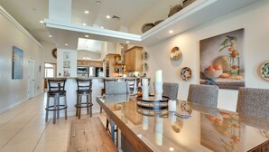 A spacious kitchen with high ceilings, modern cabinetry, and a central island. - Lake Havasu City Escape w/ Pool, Patio & Grill! (Lake Havasu City)