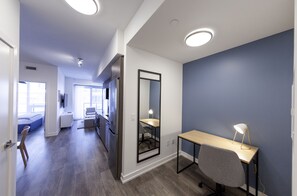 Business Apartment | Living area | 55-inch Smart TV with digital channels, TV, streaming services - The Laundry Rooms Station Park Kitchener (Kitchener)