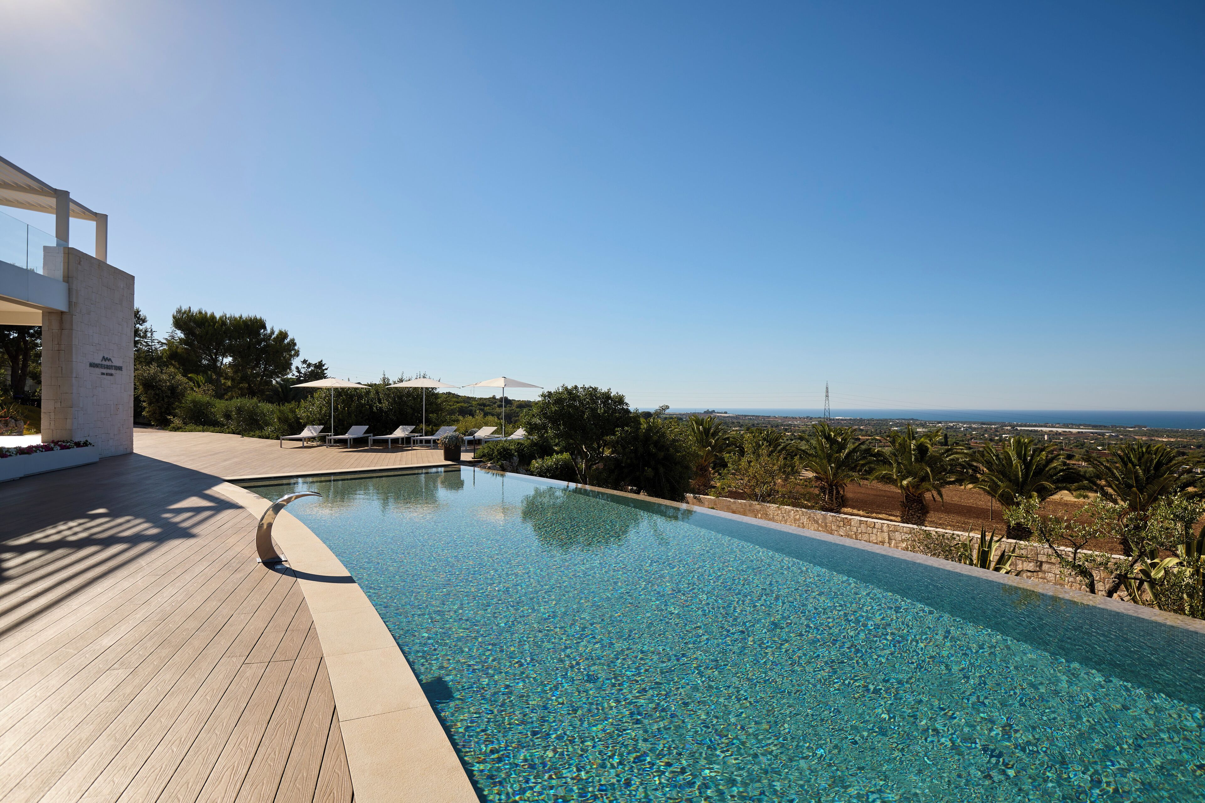 Seasonal outdoor pool, open 7:00 AM to 8:30 PM, pool umbrellas