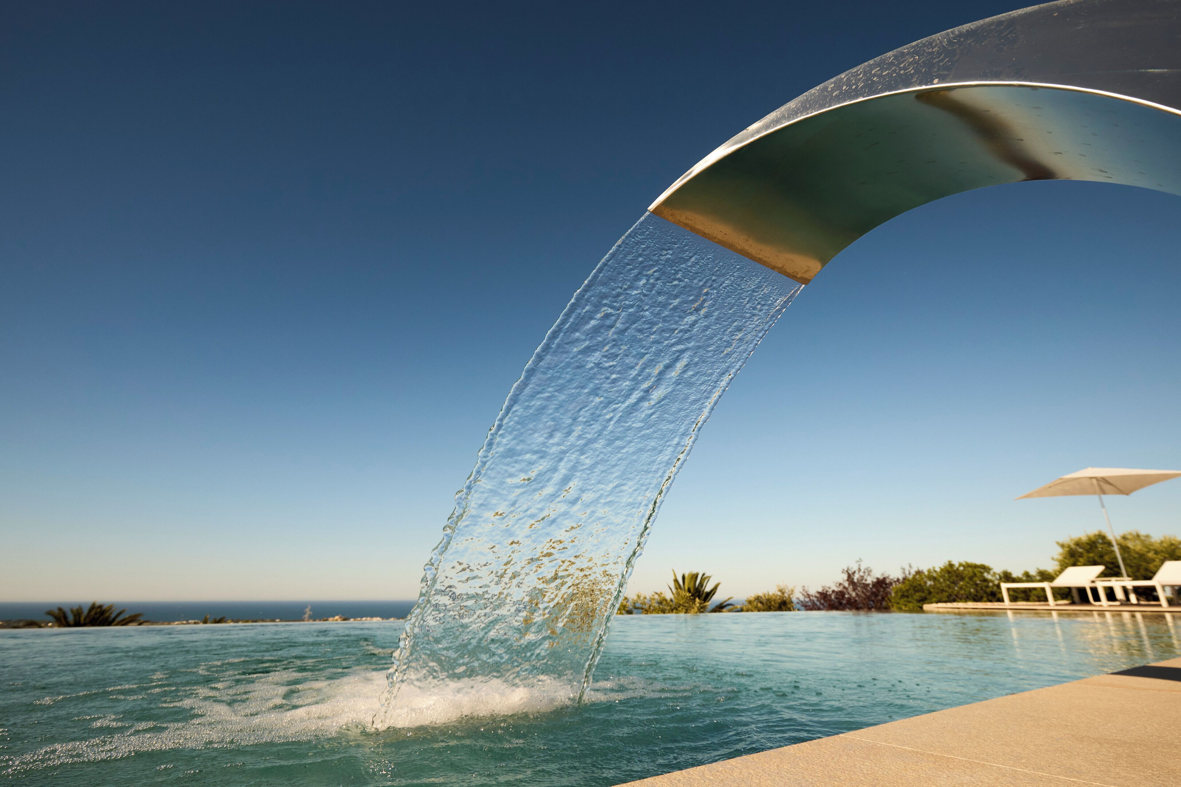 Seasonal outdoor pool, open 7:00 AM to 8:30 PM, pool umbrellas
