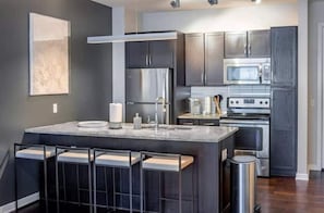 Fridge, microwave, oven, cookware/dishes/utensils