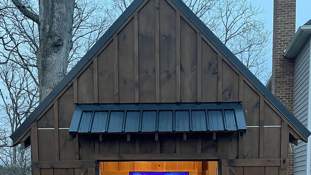 A wooden structure with a TV screen, a hot tub, and two bar stools. - Private Pool, 1st Floor Bedroom, Hershey Park, Ski Roundtop, Yellow Breeches. (Mechanicsburg)