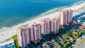 A coastal hotel with multiple high-rise buildings, a beachfront, and a parking area. - Seachase #1501W by Southern Vacation Rentals (Orange Beach)