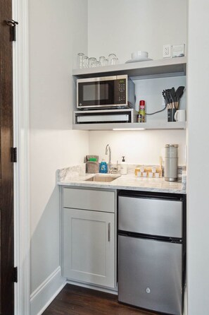 Mini-fridge, microwave, coffee/tea maker, cookware/dishes/utensils