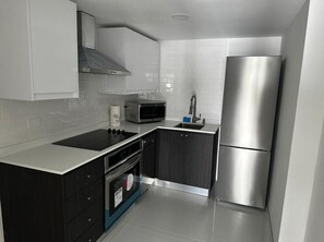 Fridge, microwave, oven, stovetop - Suite 2 · Majestic 2-Bedroom Beachside Suite (San Juan)