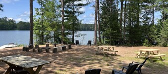 New!  Sleeps 15 Level lawn to lake.  Sandy beach.  Two docks. Great fishing.