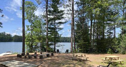New! Sleeps 15 Level lawn to lake. Sandy beach. Two docks. Great fishing.