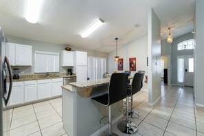 Fridge, microwave, coffee/tea maker, dining tables