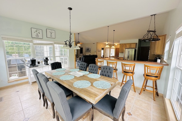 Beautiful dining set up just right across the spacious kitchen