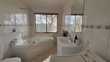 Jetted bath, eco-friendly toiletries, hair dryer, towels