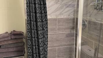 Shower, hair dryer, towels, soap